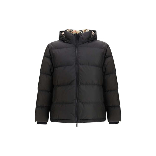 Black Polyester ClothingThe Puffer Jacket by Burberry merges technical innovation with timeless heritage. Filled with goose down and insulating fibres, it offers warmth and lightness in equal measure. Detachable sleeves transform the piece into a gilet, e