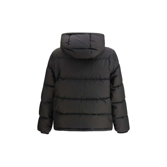 Black Polyester ClothingThe Puffer Jacket by Burberry merges technical innovation with timeless heritage. Filled with goose down and insulating fibres, it offers warmth and lightness in equal measure. Detachable sleeves transform the piece into a gilet, e