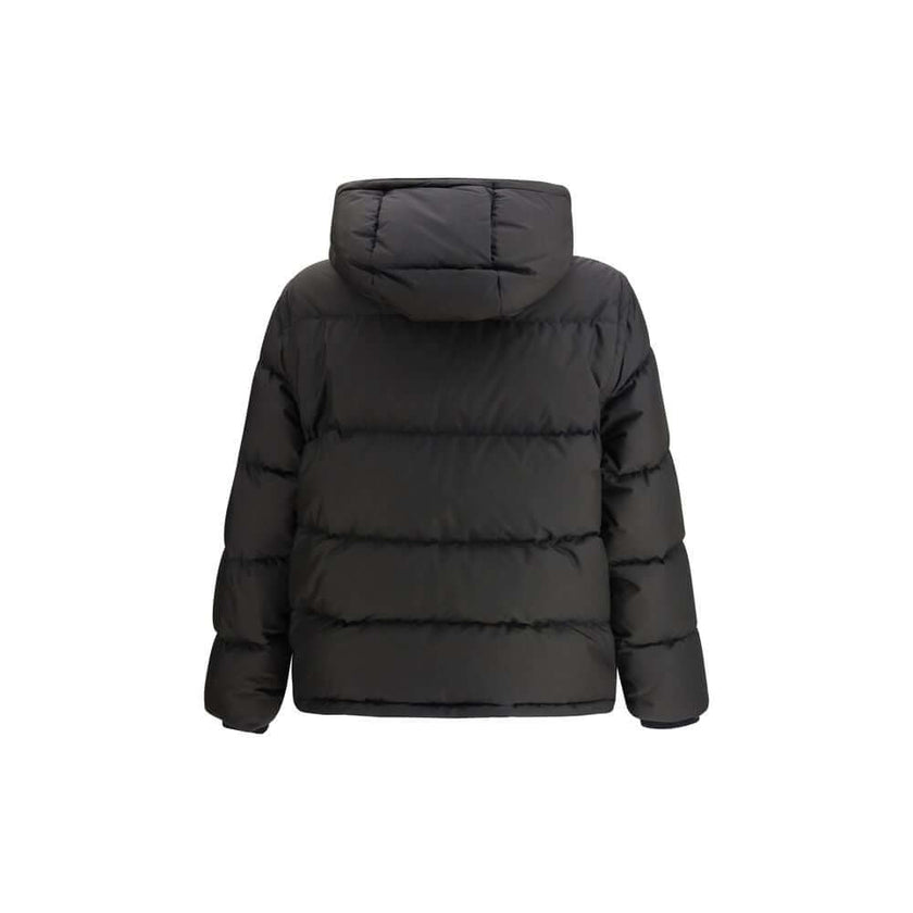 Black Polyester ClothingThe Puffer Jacket by Burberry merges technical innovation with timeless heritage. Filled with goose down and insulating fibres, it offers warmth and lightness in equal measure. Detachable sleeves transform the piece into a gilet, e