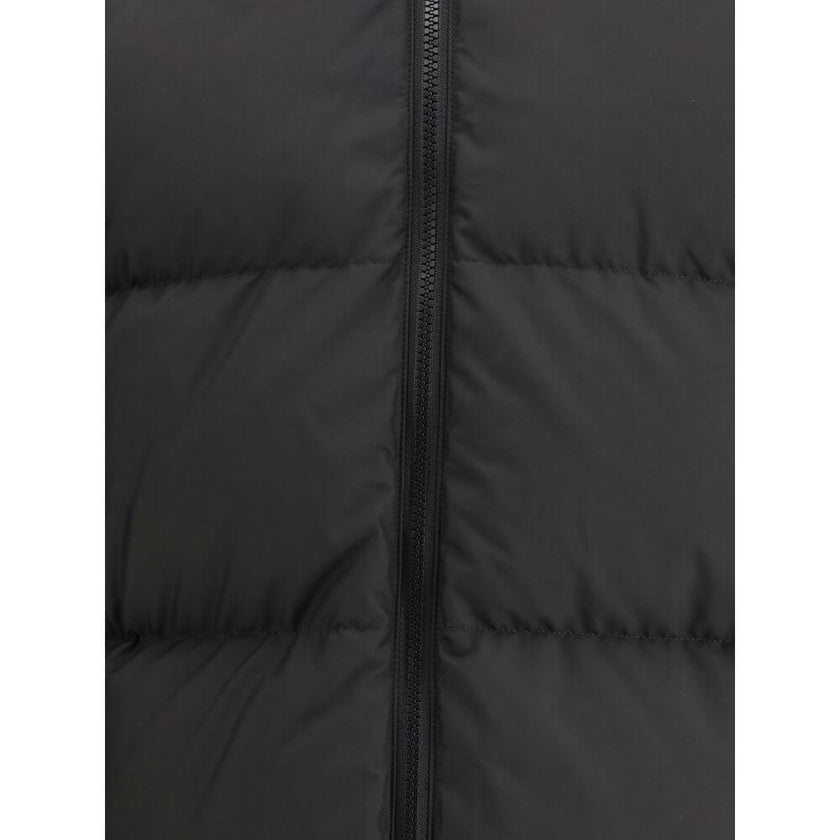 Black Polyester ClothingThe Puffer Jacket by Burberry merges technical innovation with timeless heritage. Filled with goose down and insulating fibres, it offers warmth and lightness in equal measure. Detachable sleeves transform the piece into a gilet, e