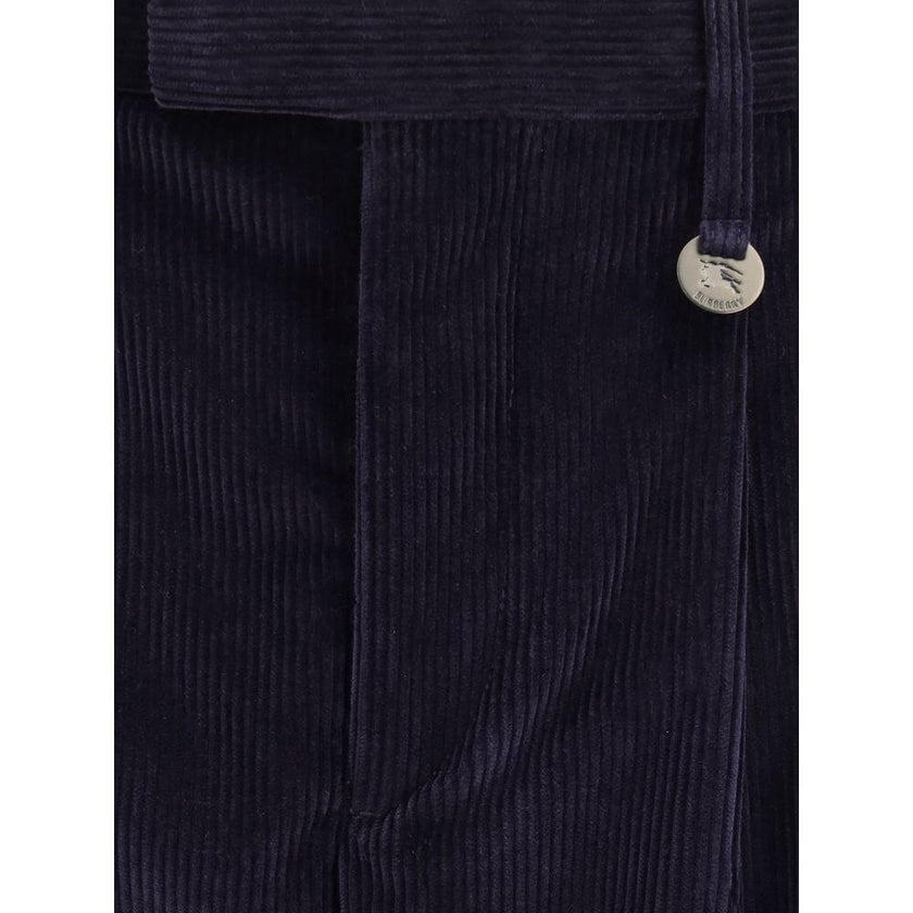 Blue Cotton PantsThe cotton corduroy Trousers by Burberry embody the authentic spirit of British elegance, reinterpreted with a modern sensibility. The relaxed cut with triple pleats and turn-up cuffs creates a refined, easy silhouette, while the hook, bu