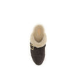 Brown Fur ClogsThe Jeannette Clogs by Chloé are crafted from suede and lined with soft shearling for warm, cozy comfort. They are embellished with gold-tone studs and buckles shaped like the brand’s initial. The wooden sole and suede upper combine traditi