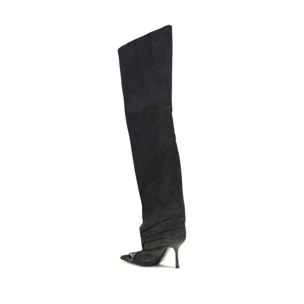 Black Fabric Over The KneeThe Venus high Boots by Diesel combine bold character and contemporary style. Made of black denim with a coated wash, they stand out with a wide, slightly gathered shaft that wraps around the leg to the thigh. The tapered toe and