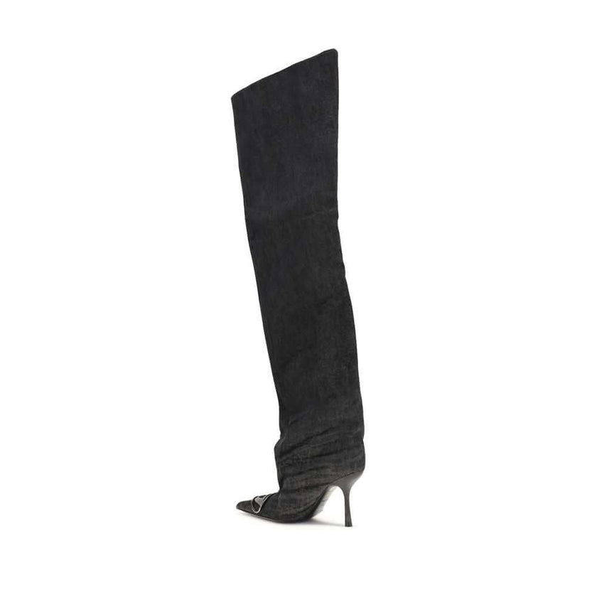 Black Fabric Over The KneeThe Venus high Boots by Diesel combine bold character and contemporary style. Made of black denim with a coated wash, they stand out with a wide, slightly gathered shaft that wraps around the leg to the thigh. The tapered toe and