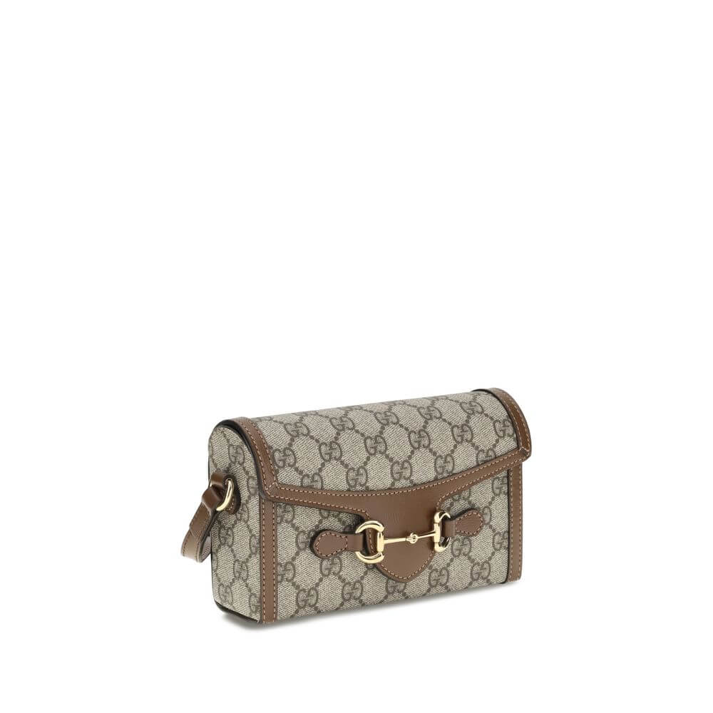 Brown Polyethylene Shoulder BagGucci’s Horsebit mini 1955 Shoulder Bag combines elegance and sustainability thanks to the beige and ebony GG Supreme fabric, made from materials with reduced environmental impact. Enhanced with brown leather trim and gold-t