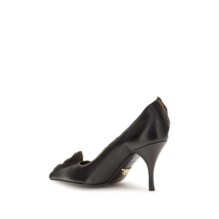 Black Leather High Heel PumpsPrada’s leather Pumps are an elegant model with retro appeal, made of leather with a vintage effect. The pointed silhouette is enhanced by the laminated printed logo on the instep, a distinctive and sophisticated detail. The d