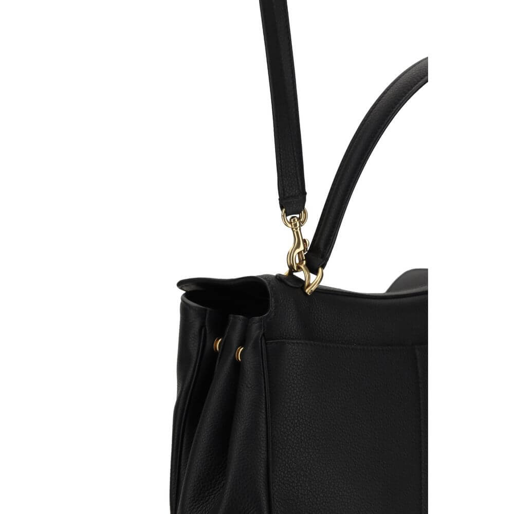 Black Calf Leather Bos Taurus Shoulder BagBalenciaga’s signature leather Rodeo Shoulder Bag is a sophisticated and versatile accessory. The flat handle at the top offers a comfortable grip, while the removable shoulder strap allows you to adapt it to your