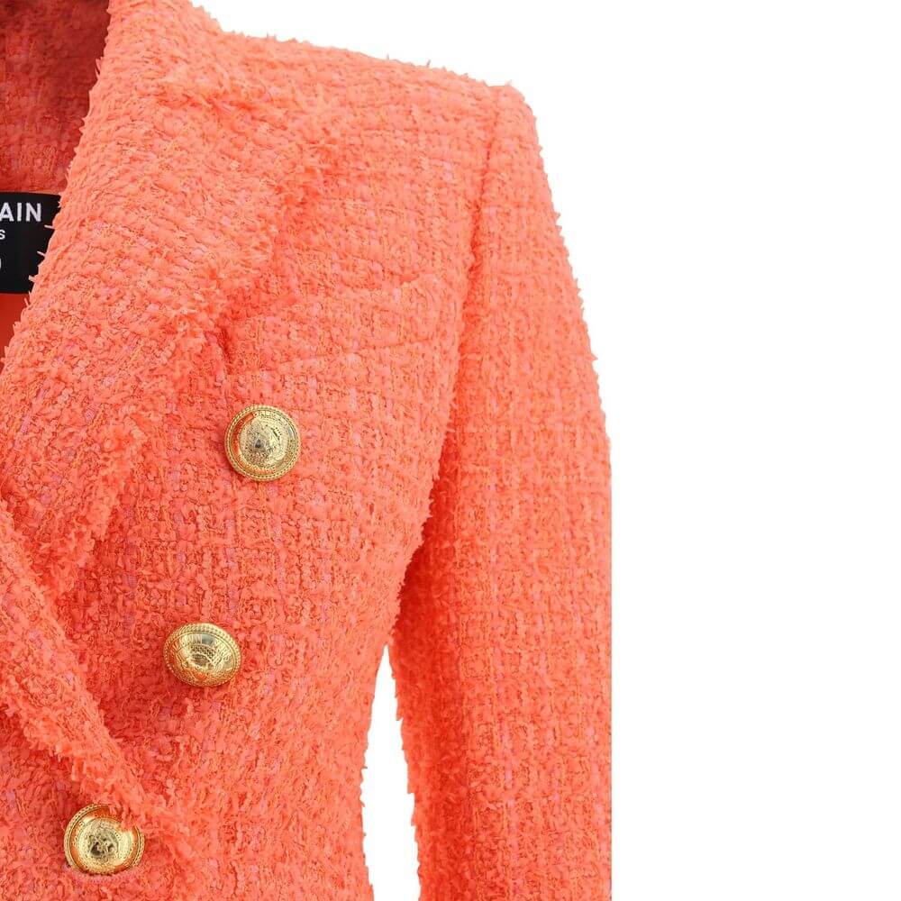 Orange Cotton BlazerDescription: – Composition: 6% Cotton 79% Polyamide 15% Wool – Long sleeves – Peak lapels – Front button closure – Button cuffs – Two side pocket with flap – One small front pocket – Made in Poland – Gender: WOMEN – Size & Fit: – Fits