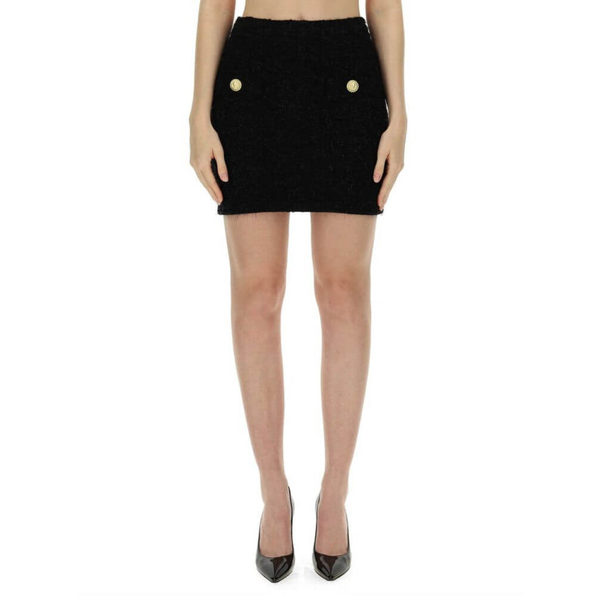 Black Cotton Mini SkirtDescription: – Composition: 25% Cotton 36% Polyamide 7% Polyester 32% Viscose – Back zip closure – Dry clean – Two gold-tone button detail – Gender: WOMEN – Size & Fit: THE MODEL IS 180 CM TALL AND WEARS A SIZE 38 FR. REGULAR FIT.Bl