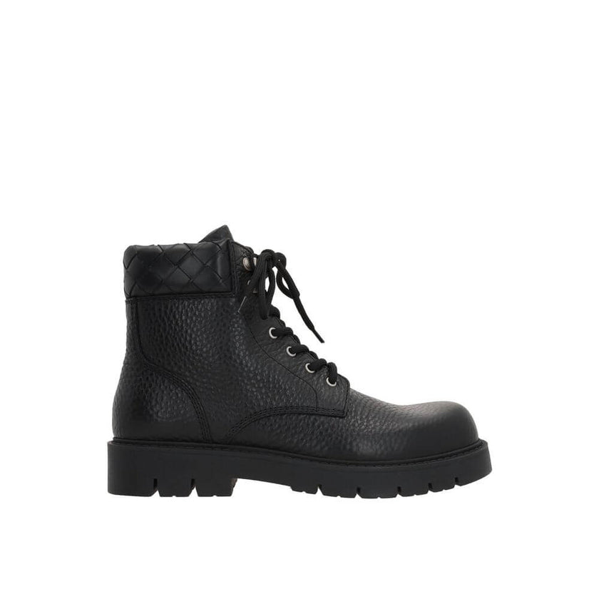 Black Calfskin Lace-Up BootsDescription: – Composition: 100% calf leather – Inner: Leather – Insole: Leather – Sole: Rubber – Round toe – Textured leather – Front lace-up closure – Metal eyelets – Tank sole – Tone-on-tone woven motif on the collar of the