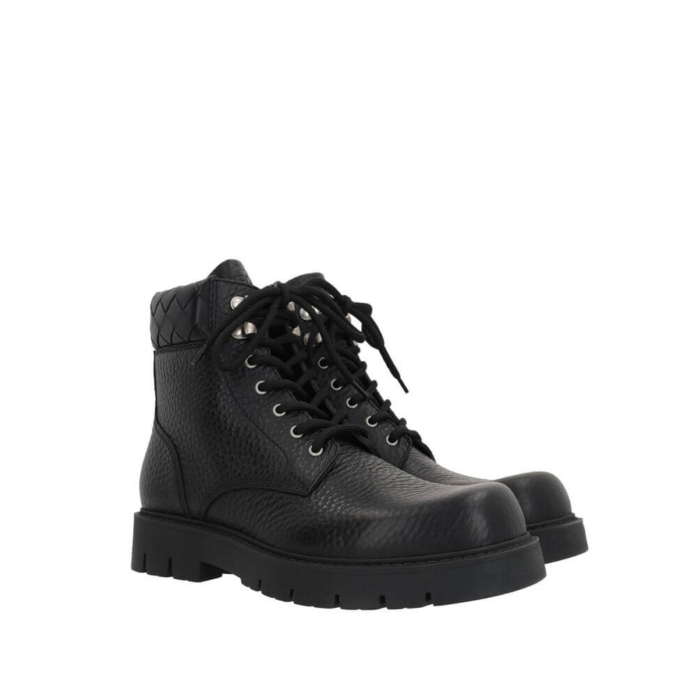 Black Calfskin Lace-Up BootsDescription: – Composition: 100% calf leather – Inner: Leather – Insole: Leather – Sole: Rubber – Round toe – Textured leather – Front lace-up closure – Metal eyelets – Tank sole – Tone-on-tone woven motif on the collar of the