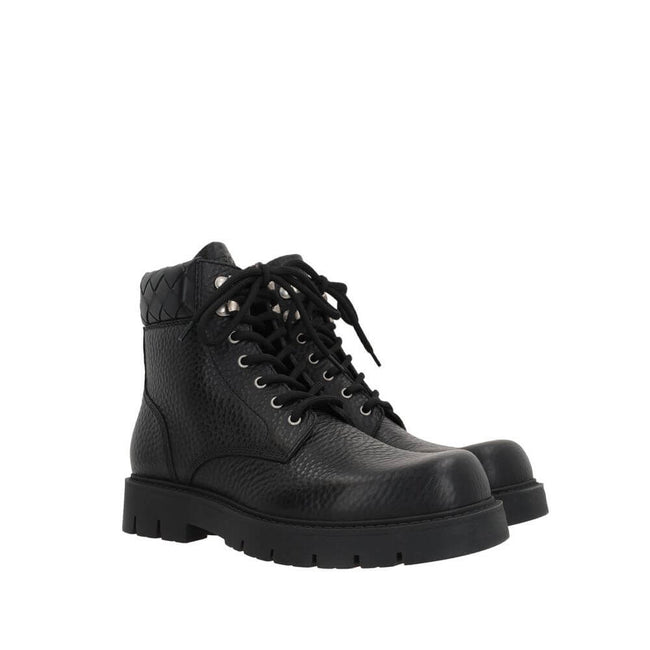 Black Calfskin Lace-Up BootsDescription: – Composition: 100% calf leather – Inner: Leather – Insole: Leather – Sole: Rubber – Round toe – Textured leather – Front lace-up closure – Metal eyelets – Tank sole – Tone-on-tone woven motif on the collar of the