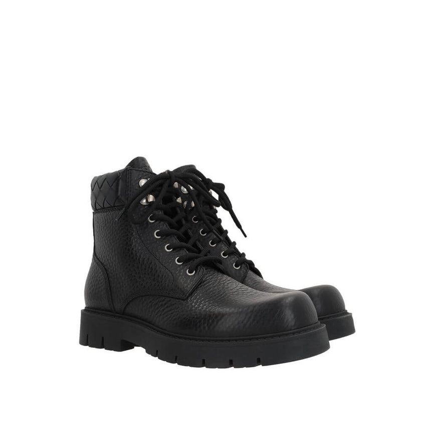 Black Calfskin Lace-Up BootsDescription: – Composition: 100% calf leather – Inner: Leather – Insole: Leather – Sole: Rubber – Round toe – Textured leather – Front lace-up closure – Metal eyelets – Tank sole – Tone-on-tone woven motif on the collar of the