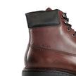 Brown Calfskin Lace-Up BootsDescription: – Composition: 100% calf leather – Inner: Leather – Insole: Leather – Sole: Rubber – Round toe – Front lace-up closure – Side logo detail – Metal eyelets – Re-Nylon accents – Stamped notch effect sole – Hot-stamped