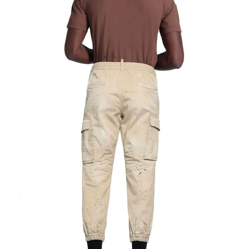 Beige Cotton Cargo PantsDescription: – Composition: 97% Cotton 3% Elastane – Elasticated waist – Two side pockets – Belt loops – Machine wash – Regular fit – Two back pockets – Button and zip closure – Velcro strap cuffs – Two side flap pockets – Gender: