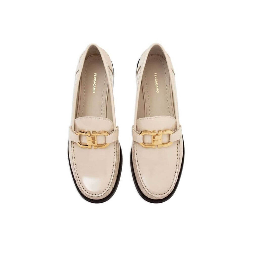 White Calfskin Slip-On LoafersDescription: – Composition: 100% calf leather – Inner: Leather – Insole: Leather – Sole: Leather – Round toe – Patent effect – Gold-tone logo hardware – Slip-on design – Made in Italy – Gender: WOMEN –White Calfskin Slip-On L