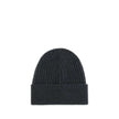 Black Merino Wool BeanieBeanie Hat by Moncler Grenoble combines functionality and style in an essential cold-weather accessory. Made with ribbed fabrication, it offers a snug and comfortable fit. The Moncler Grenoble logo sewn on the front adds a distinct