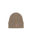 Beige Merino Wool BeanieBeanie Hat by Moncler Grenoble combines functionality and style in an essential cold-weather accessory. Made with ribbed fabrication, it offers a snug and comfortable fit. The Moncler Grenoble logo sewn on the front adds a distinct