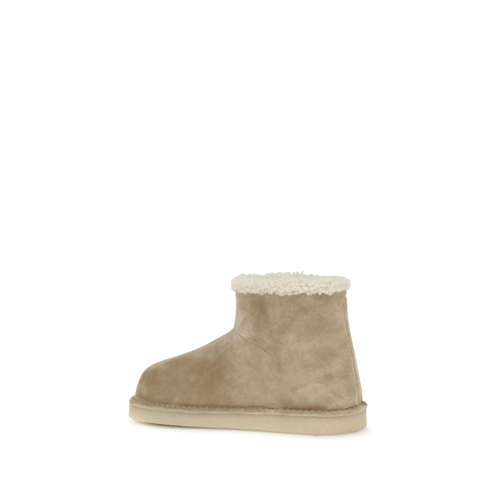 Beige Leather Flat BootsMiu Miu’s furry Ankle Boots combine comfort and style in an eye-catching design. With ankle height, they feature a flat sole and a rounded toe for a comfortable fit. The fur detail wraps the model with a soft, luxurious touch, whil