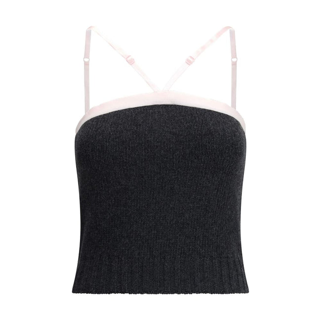 Gray Fleece Wool TopPrada’s virgin wool crop Top combines simplicity and style in an essential piece. Featuring thin, adjustable straps, it has a ribbed hem that enhances the silhouette. The triangular logo on the front adds a distinctive and refined deta