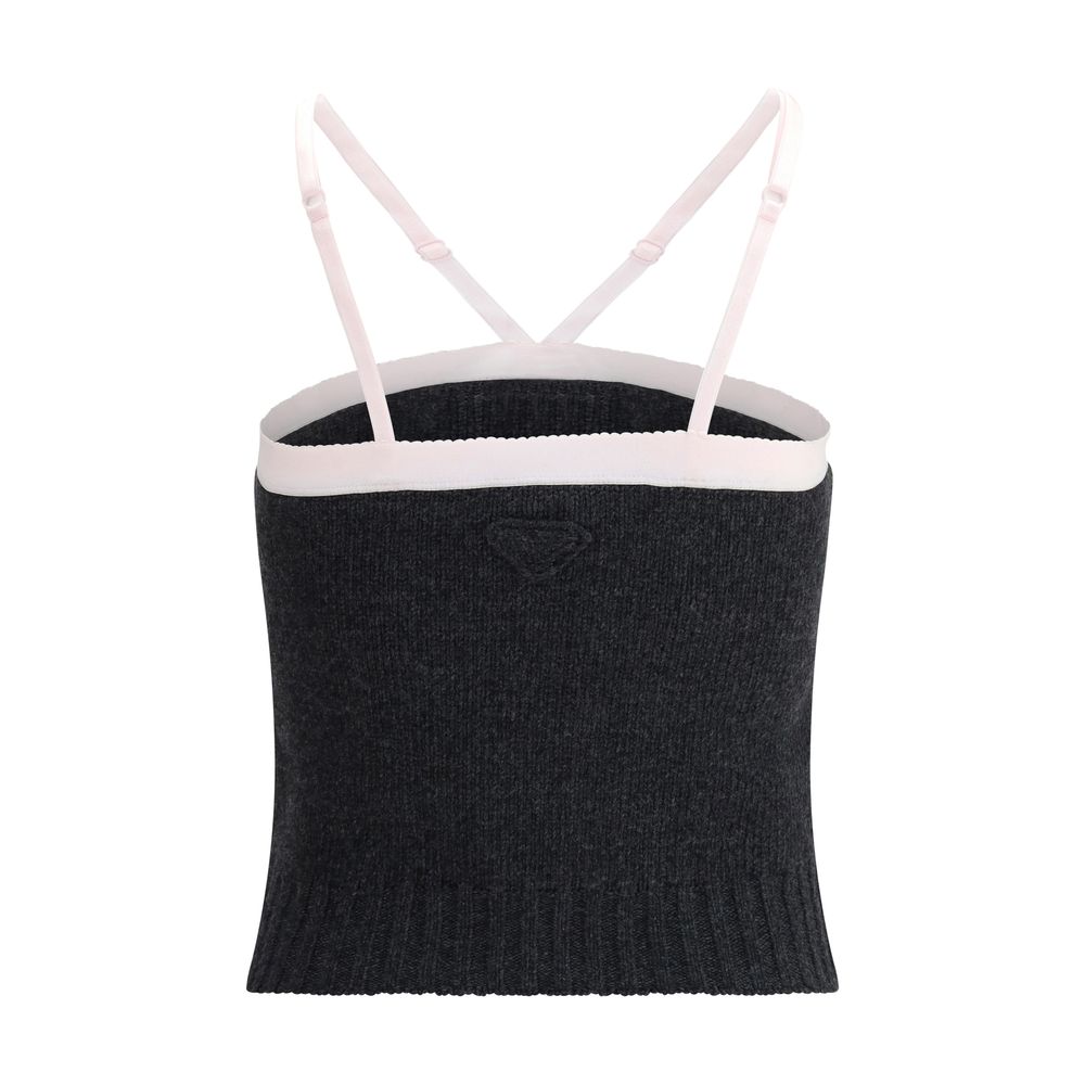 Gray Fleece Wool TopPrada’s virgin wool crop Top combines simplicity and style in an essential piece. Featuring thin, adjustable straps, it has a ribbed hem that enhances the silhouette. The triangular logo on the front adds a distinctive and refined deta