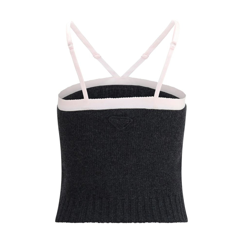 Gray Fleece Wool TopPrada’s virgin wool crop Top combines simplicity and style in an essential piece. Featuring thin, adjustable straps, it has a ribbed hem that enhances the silhouette. The triangular logo on the front adds a distinctive and refined deta
