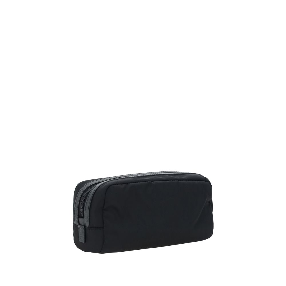 Black Recycled Polyamide AccessoriesRe-Nylon Beauty Case by Prada, top zipper closure, triangular logo plaque applied to front, leather details. Season: AW25 Dimension: 20x20x8 Composition: 100% Recycled Polyamide MADE IN ITALYBlack Recycled Polyamide Acc