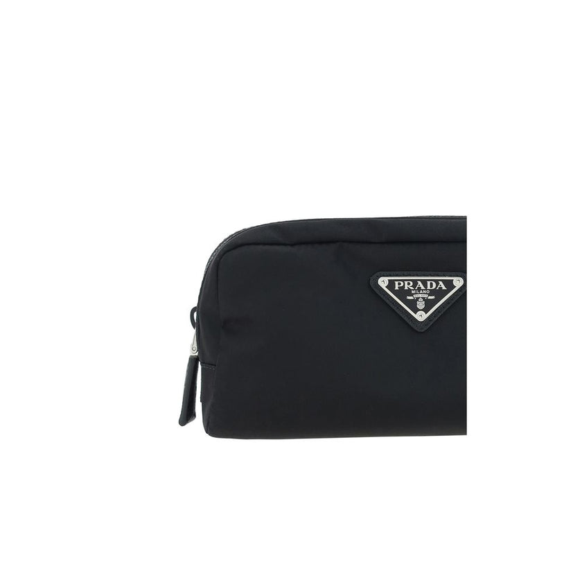 Black Recycled Polyamide AccessoriesRe-Nylon Beauty Case by Prada, top zipper closure, triangular logo plaque applied to front, leather details. Season: AW25 Dimension: 20x20x8 Composition: 100% Recycled Polyamide MADE IN ITALYBlack Recycled Polyamide Acc