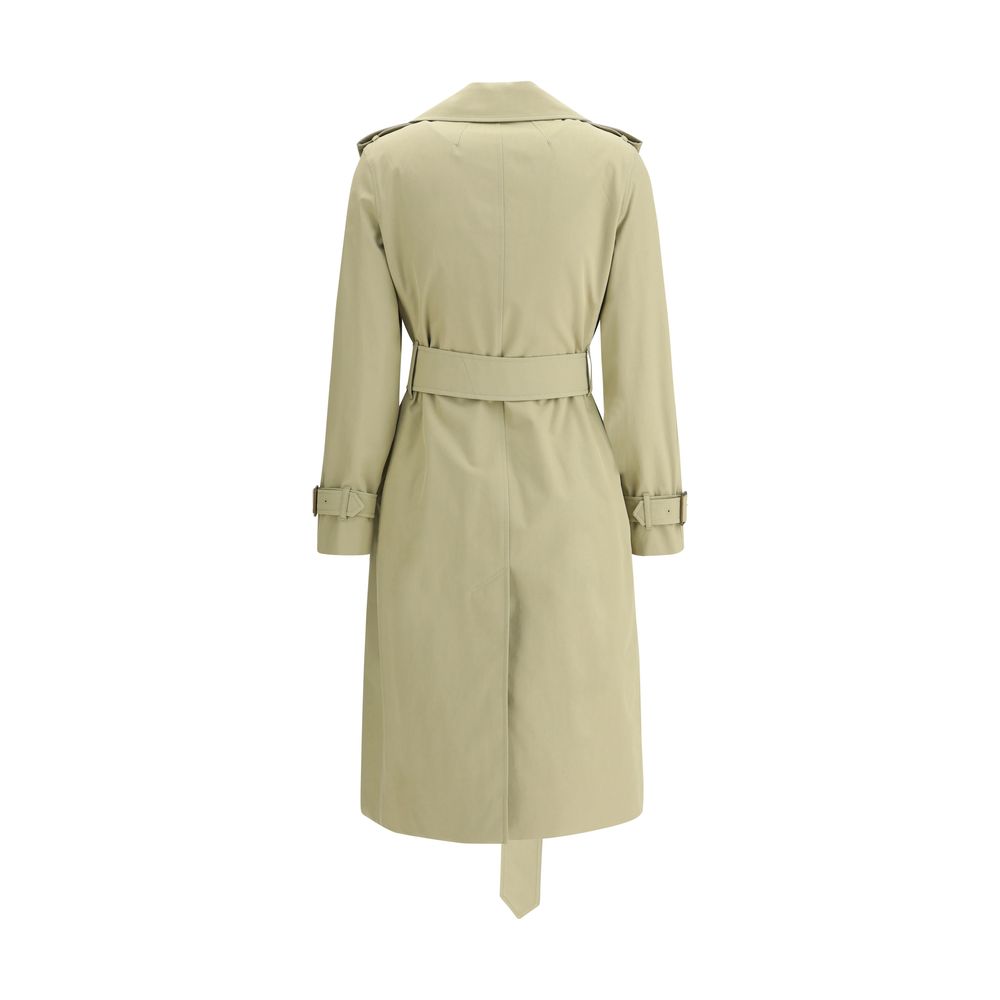 Beige Cotton Trench CoatThe Burberry cotton Trench Coat features wide notch lapels and a double-breasted front fastening with buttons, which enhance its timeless elegance. The two side welt pockets add a practical and refined touch, while a vent at the ba