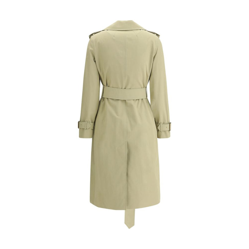 Beige Cotton Trench CoatThe Burberry cotton Trench Coat features wide notch lapels and a double-breasted front fastening with buttons, which enhance its timeless elegance. The two side welt pockets add a practical and refined touch, while a vent at the ba