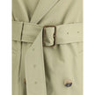 Beige Cotton Trench CoatThe Burberry cotton Trench Coat features wide notch lapels and a double-breasted front fastening with buttons, which enhance its timeless elegance. The two side welt pockets add a practical and refined touch, while a vent at the ba
