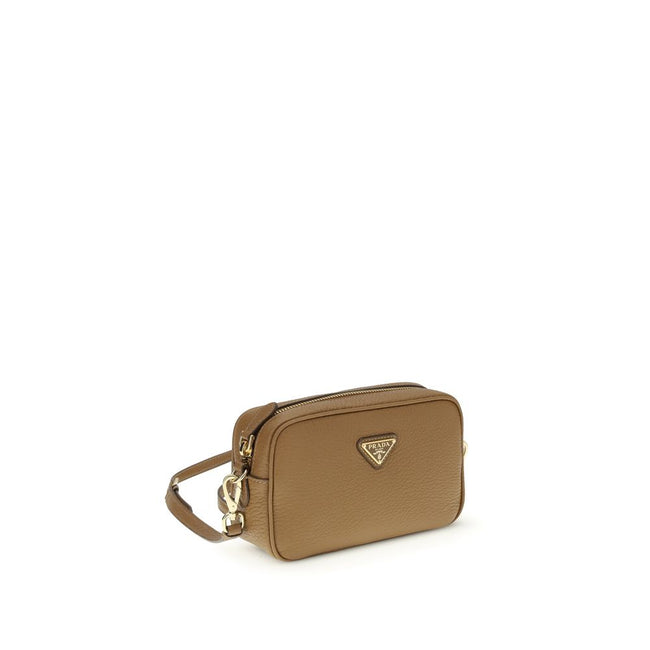Beige Calf Leather Bos Taurus Shoulder BagMini Shoulder Bag by Prada is a compact and essential accessory perfect for everyday use. Featuring a zippered top closure and an adjustable, removable shoulder strap, it combines practicality and style. The inter
