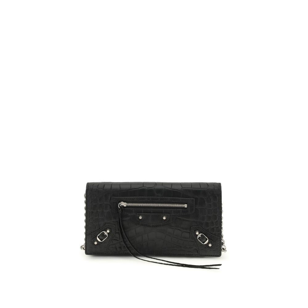 Black Calf Leather Bos Taurus Shoulder BagThe crocodile Effect Shoulder Bag by Balenciaga is an elegant and distinctive accessory featuring a refined crocodile effect that adds luxurious texture. The iconic buckles on the front and zipper pocket offer uni