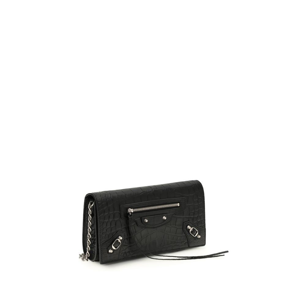 Black Calf Leather Bos Taurus Shoulder BagThe crocodile Effect Shoulder Bag by Balenciaga is an elegant and distinctive accessory featuring a refined crocodile effect that adds luxurious texture. The iconic buckles on the front and zipper pocket offer uni