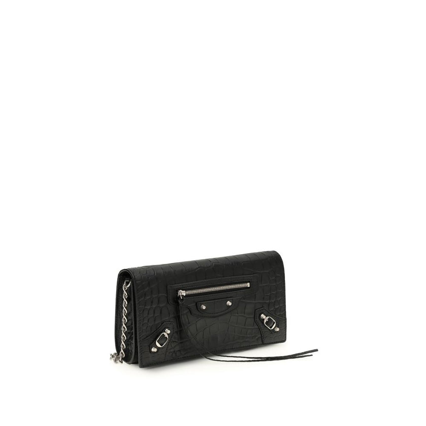 Black Calf Leather Bos Taurus Shoulder BagThe crocodile Effect Shoulder Bag by Balenciaga is an elegant and distinctive accessory featuring a refined crocodile effect that adds luxurious texture. The iconic buckles on the front and zipper pocket offer uni