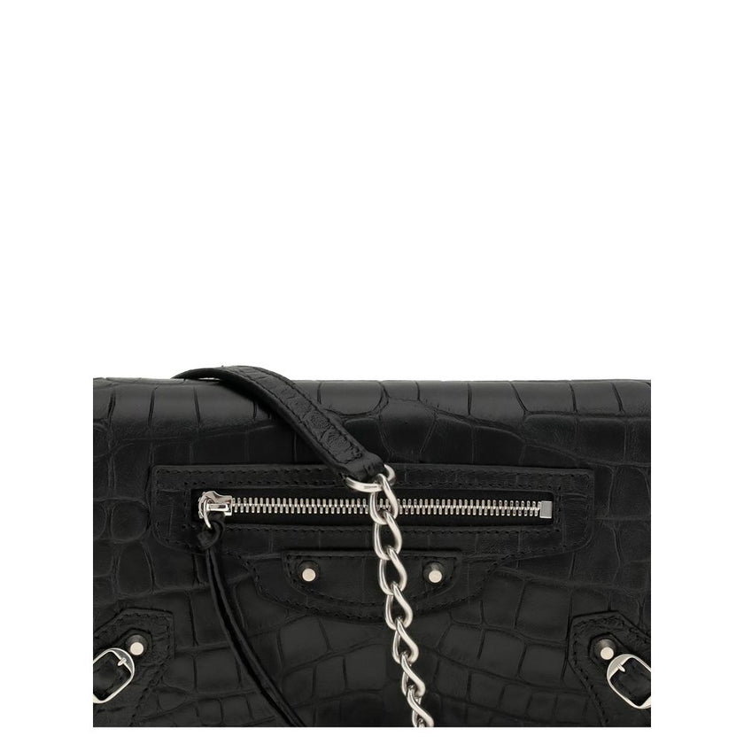 Black Calf Leather Bos Taurus Shoulder BagThe crocodile Effect Shoulder Bag by Balenciaga is an elegant and distinctive accessory featuring a refined crocodile effect that adds luxurious texture. The iconic buckles on the front and zipper pocket offer uni