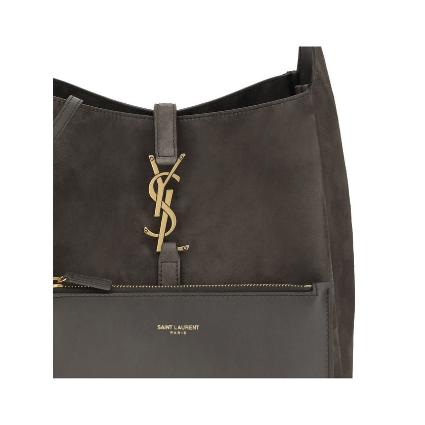 Gray Calf Leather Bos Taurus Shoulder BagThe Le 5 à 7 suede Shoulder Bag by Saint Laurent is a sophisticated and practical design perfect for any occasion. The bag features a removable zippered clutch, ideal for keeping smaller items in order. The leather