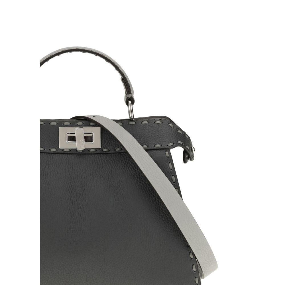 Gray Leather Shoulder BagThe Peekaboo ISeeU small Handbag by Fendi is crafted from brown Cuoio Romano leather with cappuccino-colored side panels, featuring a natural grain achieved through a metal-free tanning process.The leather-lined interior is divide