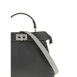 Gray Leather Shoulder BagThe Peekaboo ISeeU small Handbag by Fendi is crafted from brown Cuoio Romano leather with cappuccino-colored side panels, featuring a natural grain achieved through a metal-free tanning process.The leather-lined interior is divide