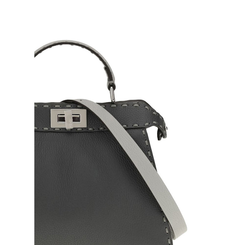Gray Leather Shoulder BagThe Peekaboo ISeeU small Handbag by Fendi is crafted from brown Cuoio Romano leather with cappuccino-colored side panels, featuring a natural grain achieved through a metal-free tanning process.The leather-lined interior is divide