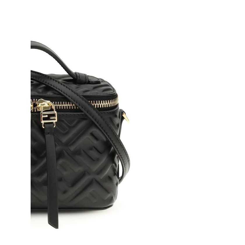 Black Calf Leather Bos Taurus HandbagVanity Handbag by Fendi is an elegant leather accessory featuring an embossed FF motif that decorates the entire surface, enhancing the house’s iconic design. Equipped with a flat leather handle and a removable shoulde