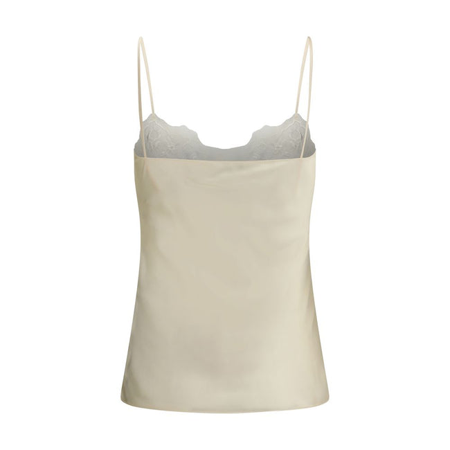 Cream Silk TopThe washed silk satin and lace Camisole by Chloé embodies delicate and refined femininity. Crafted from pure washed silk satin, it features a fluid silhouette with thin straps and lace inserts that add a romantic touch. The style can be worn