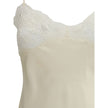 Cream Silk TopThe washed silk satin and lace Camisole by Chloé embodies delicate and refined femininity. Crafted from pure washed silk satin, it features a fluid silhouette with thin straps and lace inserts that add a romantic touch. The style can be worn