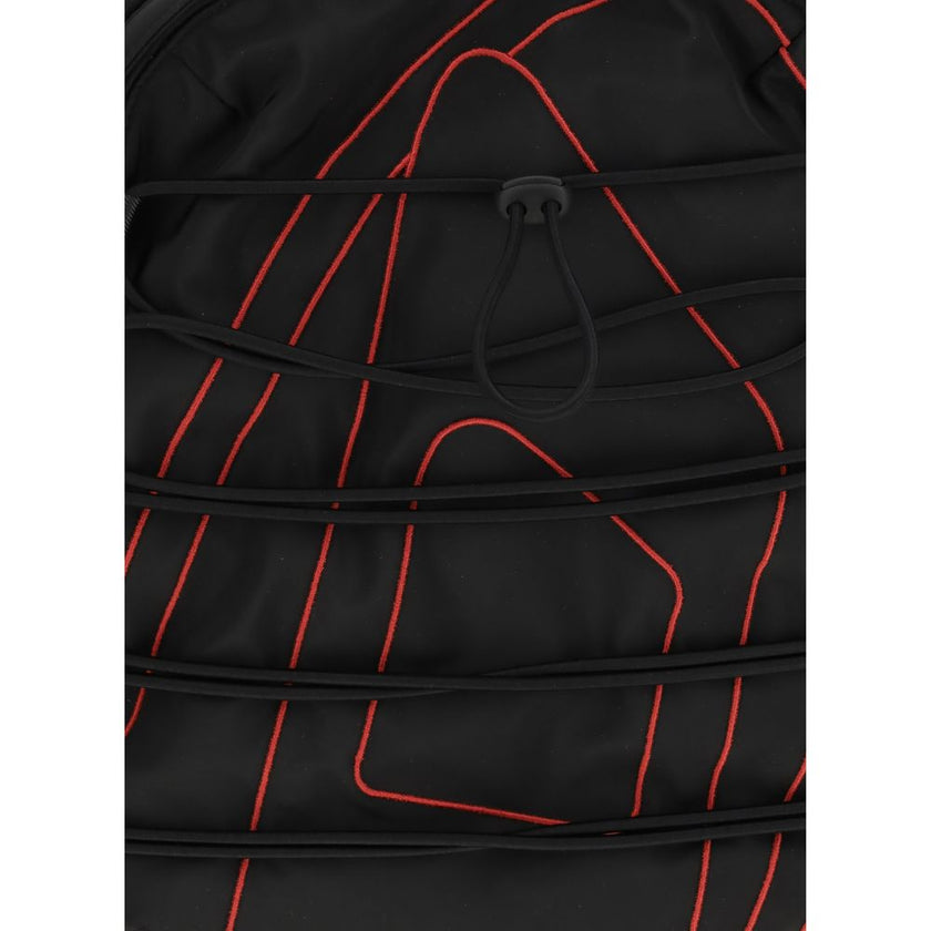 Black Polyester BackpackTech-D Backpack by Diesel is the perfect blend of functionality and urban style. Featuring a zippered top closure and drawstring detail, it offers practicality and security. Adjustable shoulder straps provide customizable comfort,