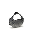 Silver Cotton Shoulder BagThe Grab-D Shoulder Bag by Diesel features a ruched silhouette made of black-wash denim embellished with reflective crystals that add a luminous touch. The belt handle with a hair clip is the distinctive detail that adds personal