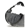 Silver Cotton Shoulder BagThe Grab-D Shoulder Bag by Diesel features a ruched silhouette made of black-wash denim embellished with reflective crystals that add a luminous touch. The belt handle with a hair clip is the distinctive detail that adds personal