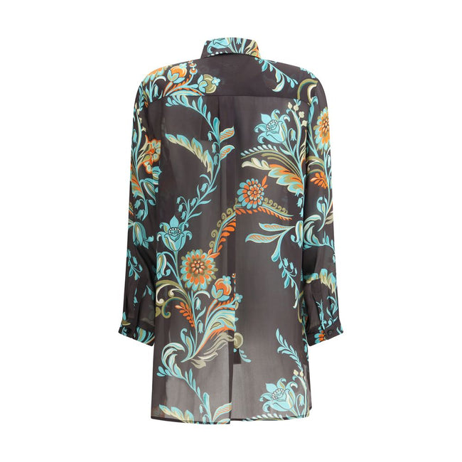 Multicolor Silk Pattern ShirtThe Long Narcissus Print Shirt by Etro is crafted from fine Peau d’Ange silk and features an all-over floral motif that reflects the Maison’s natural elegance and artistic spirit. The shirt showcases a straight, elongated silh