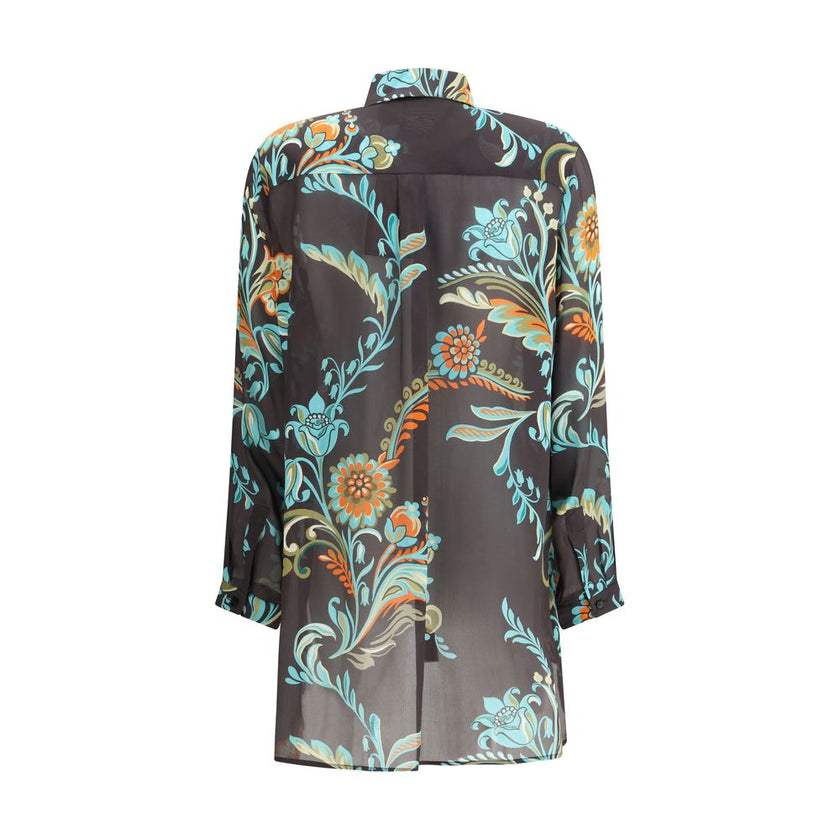 Multicolor Silk Pattern ShirtThe Long Narcissus Print Shirt by Etro is crafted from fine Peau d’Ange silk and features an all-over floral motif that reflects the Maison’s natural elegance and artistic spirit. The shirt showcases a straight, elongated silh