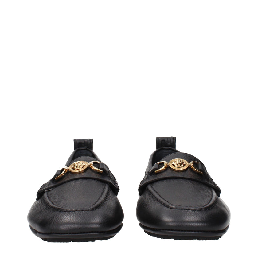 Black Leather Slip-On LoafersDescription: The product with MPN 10170721A121101B00V and code F84524 leather in black is a loafers designed by Versace. It has features like front logo. Additional Info: Style: Casual Shoe sole: Rubber Shoe tip: Round toe Hee