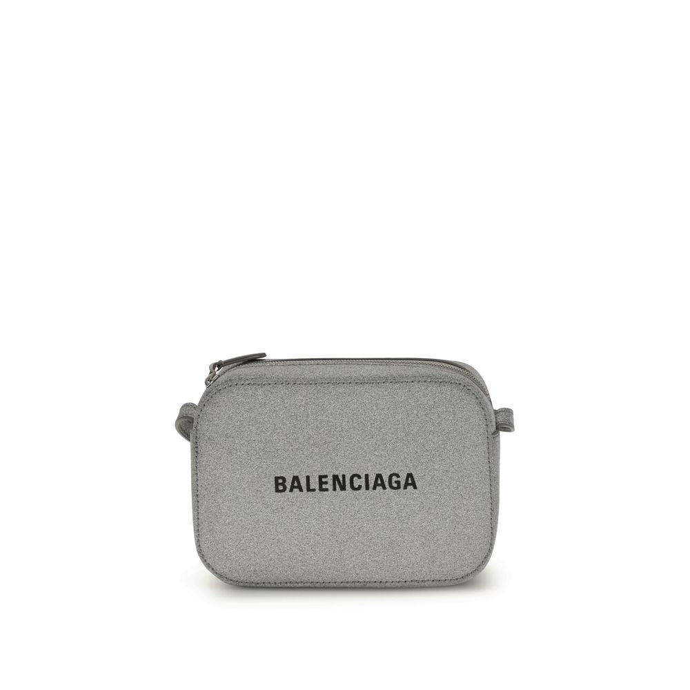 Gray Calf Leather Bos Taurus Shoulder BagSilver Calf XS Everyday Camera Shoulder Bag by Balenciaga, all covered by silver glittered, featuring printed logo on front, zip closure, adjustable shoulder strap, flat pocket at back, large flat pocket inside. Se